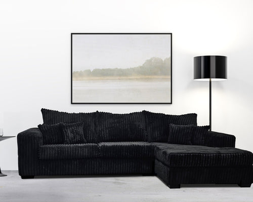 modern black corduroy sectional sofa with chaise in contemporary living room setting