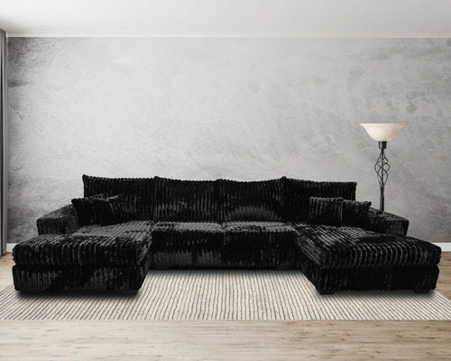 modern black corduroy sectional sofa with chaise in living room on striped rug