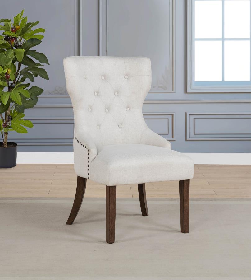 modern tufted beige accent chair with dark wood legs in elegant living room setting