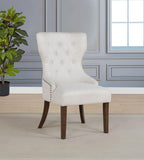 modern tufted beige accent chair with dark wood legs in elegant living room setting