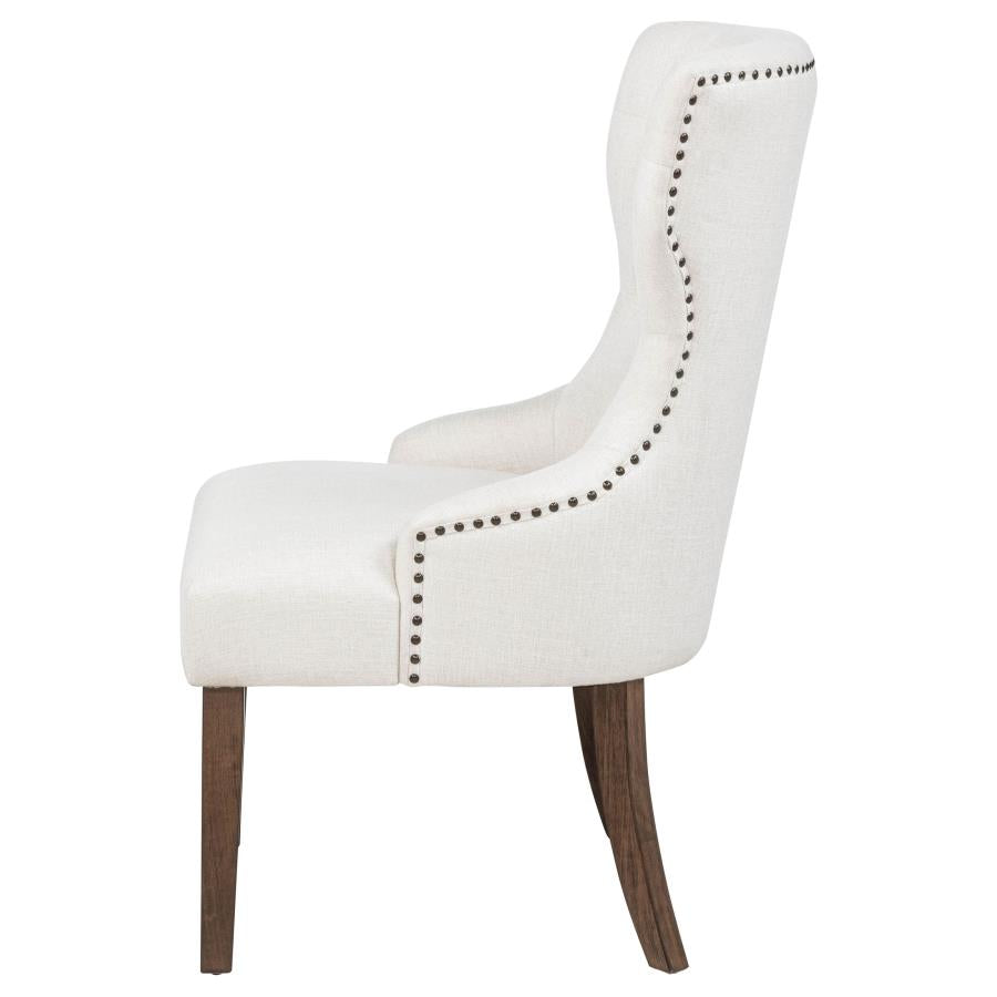 modern ivory upholstered accent chair with nailhead trim and dark wood legs for living room