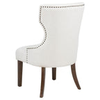 cream upholstered accent chair with nailhead trim and dark wood legs, perfect for dining room