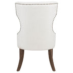 modern cream upholstered accent chair with nailhead trim and dark wood legs for living room