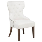 modern ivory upholstered accent chair with button-tufted back and wooden legs for living room