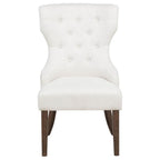 modern white upholstered accent chair with tufted back and dark wood legs for living room