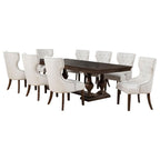 Traditional dark wood dining table with eight tufted cream upholstered chairs, ideal for dining room