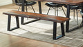 Live edge wood dining bench with natural grain finish and black metal frame legs on geometric area rug.