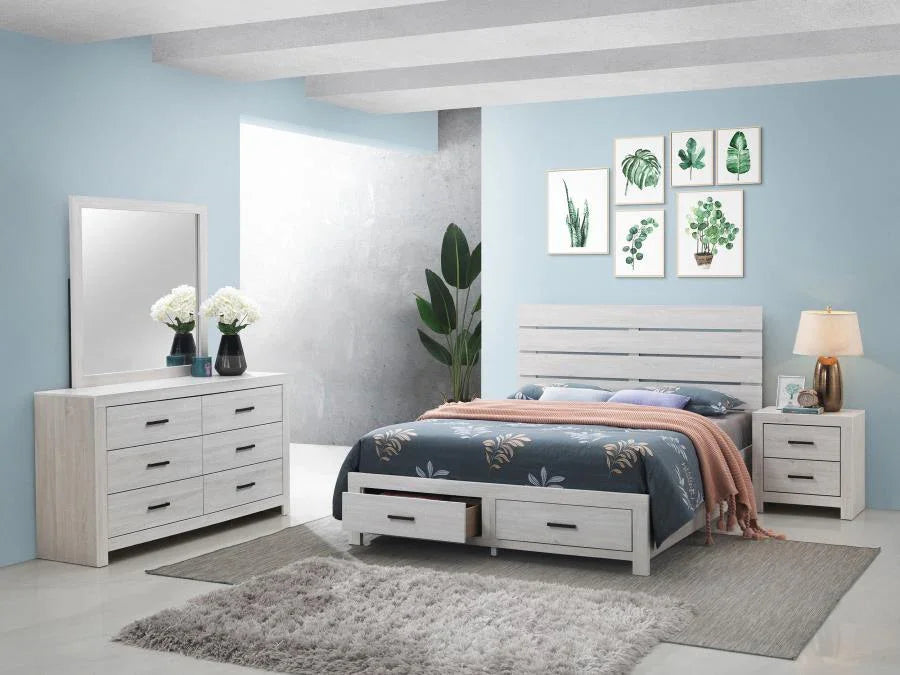 Modern coastal white bedroom set with king bed, dresser, mirror, nightstands, and storage drawers on light gray rug.
