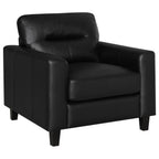 Black faux leather armchair with track arms, padded back, and dark wooden legs on white background.