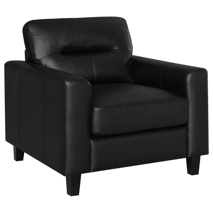 Black faux leather armchair with track arms, padded back, and dark wooden legs on white background.