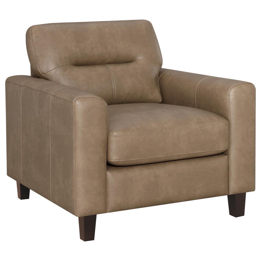 Brown faux leather armchair with track arms, cushioned seat, and dark wood legs on white background.