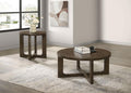 Two round brown wood coffee tables with sculptural open bases displayed on a light area rug in a minimalist living room.