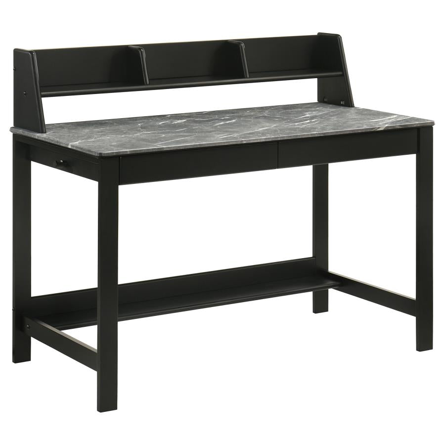 Black wooden desk with grey stone top and upper storage compartments, featuring open shelving and modern minimalist design.