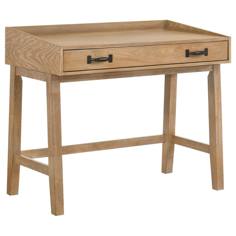 Distressed light brown wooden desk with single drawer, black handles, and four-leg frame design.