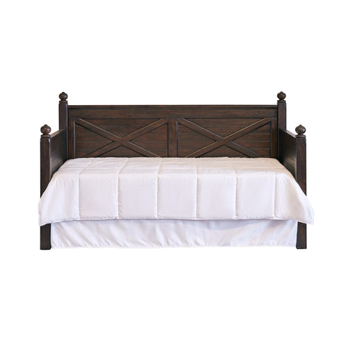 Sutherland walnut-finish twin daybed with X-design sides and back, dark wood, straight legs, white bedding.