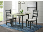 Modern black drop leaf dining table with two cushioned chairs on blue rug in bright dining room
